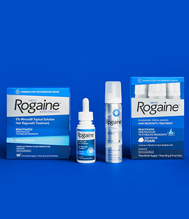 Men’s Rogaine Topical and Foam Solution with boxes on a blue background.